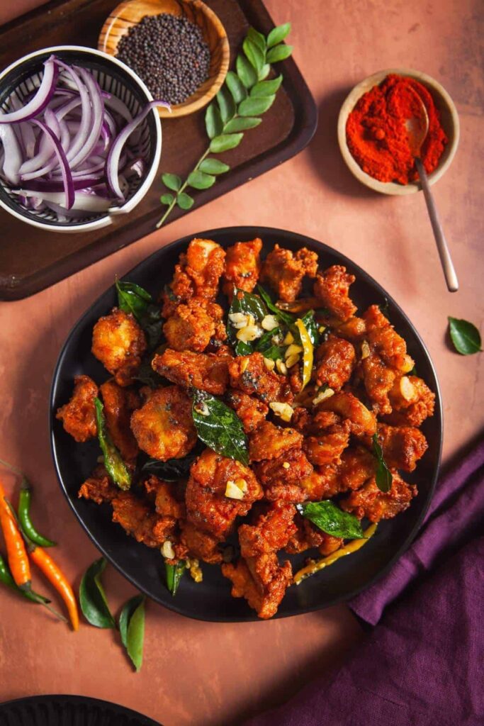 How to Make Spicy and Tangy Chicken 65 Recipe In 2024